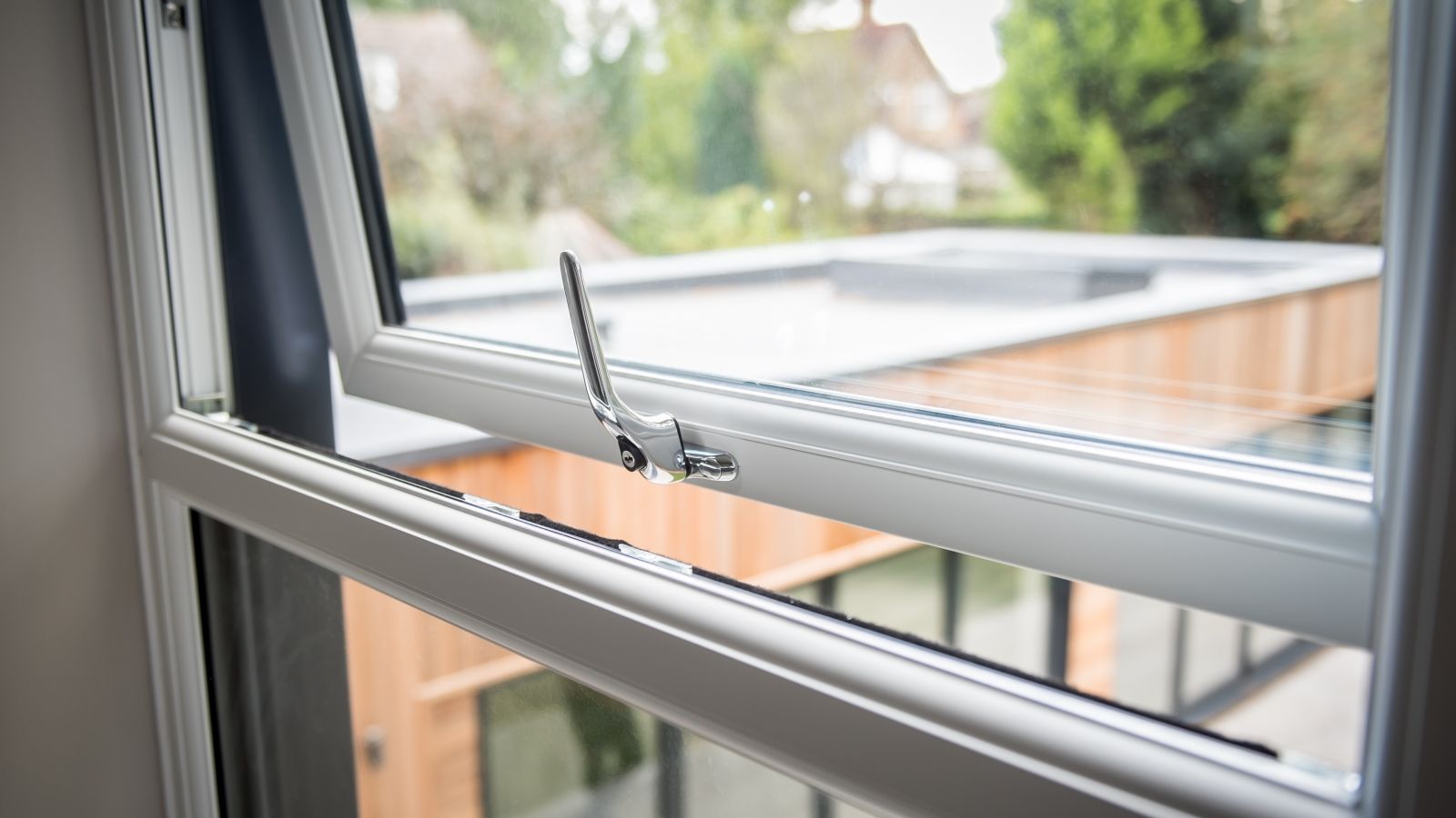 Close-up of a white Liniar 70mm uPVC casement window with slim sightlines